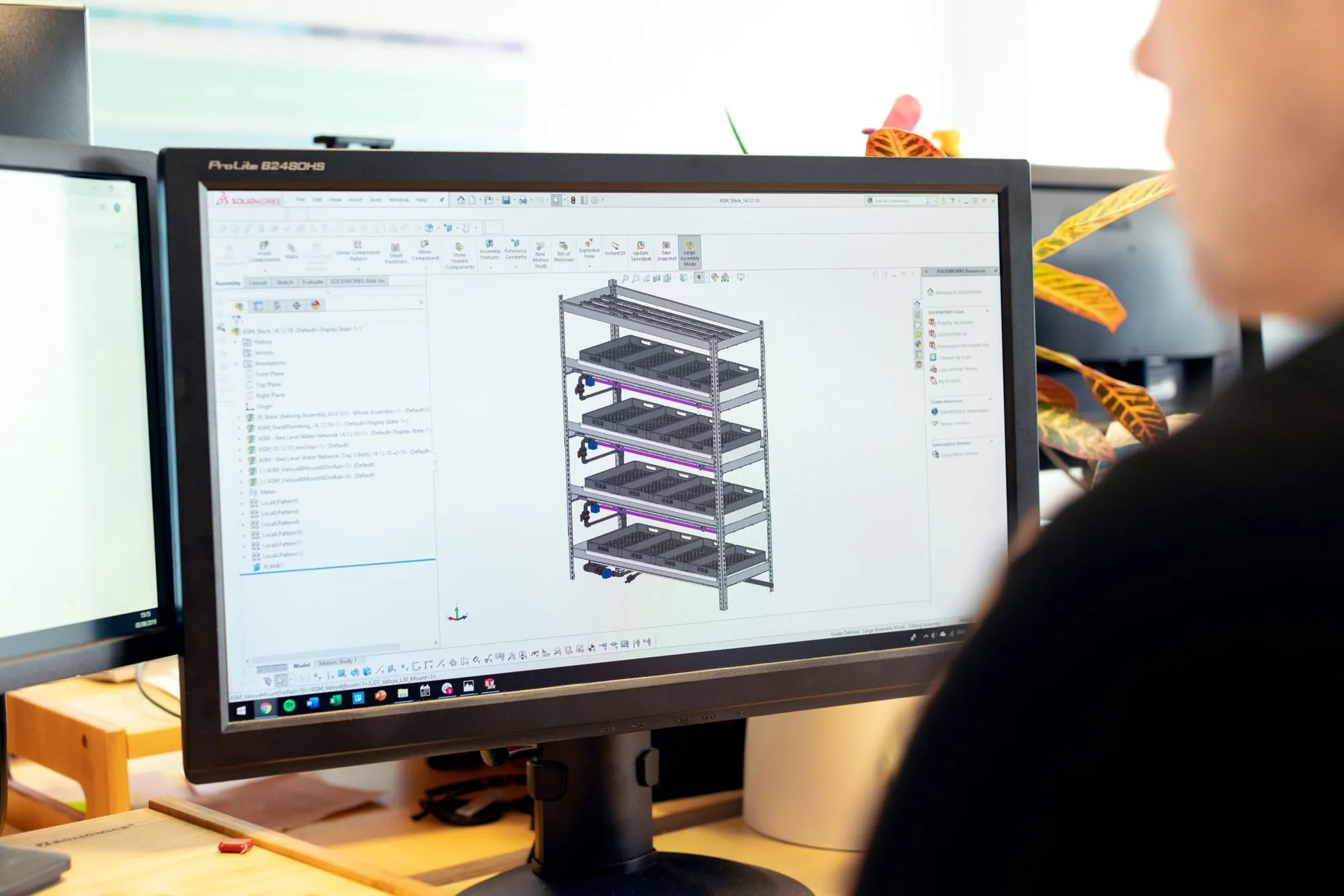 Architect reviewing a building model on a monitor