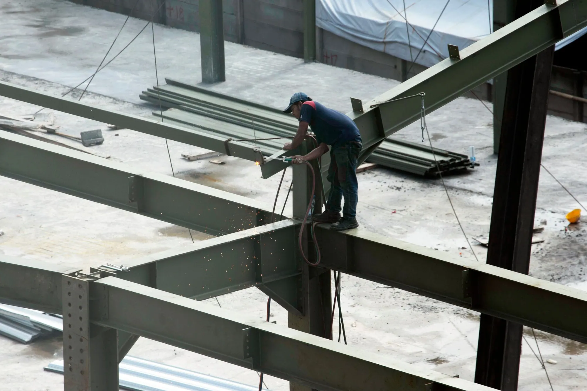An ironworker on a steel beam