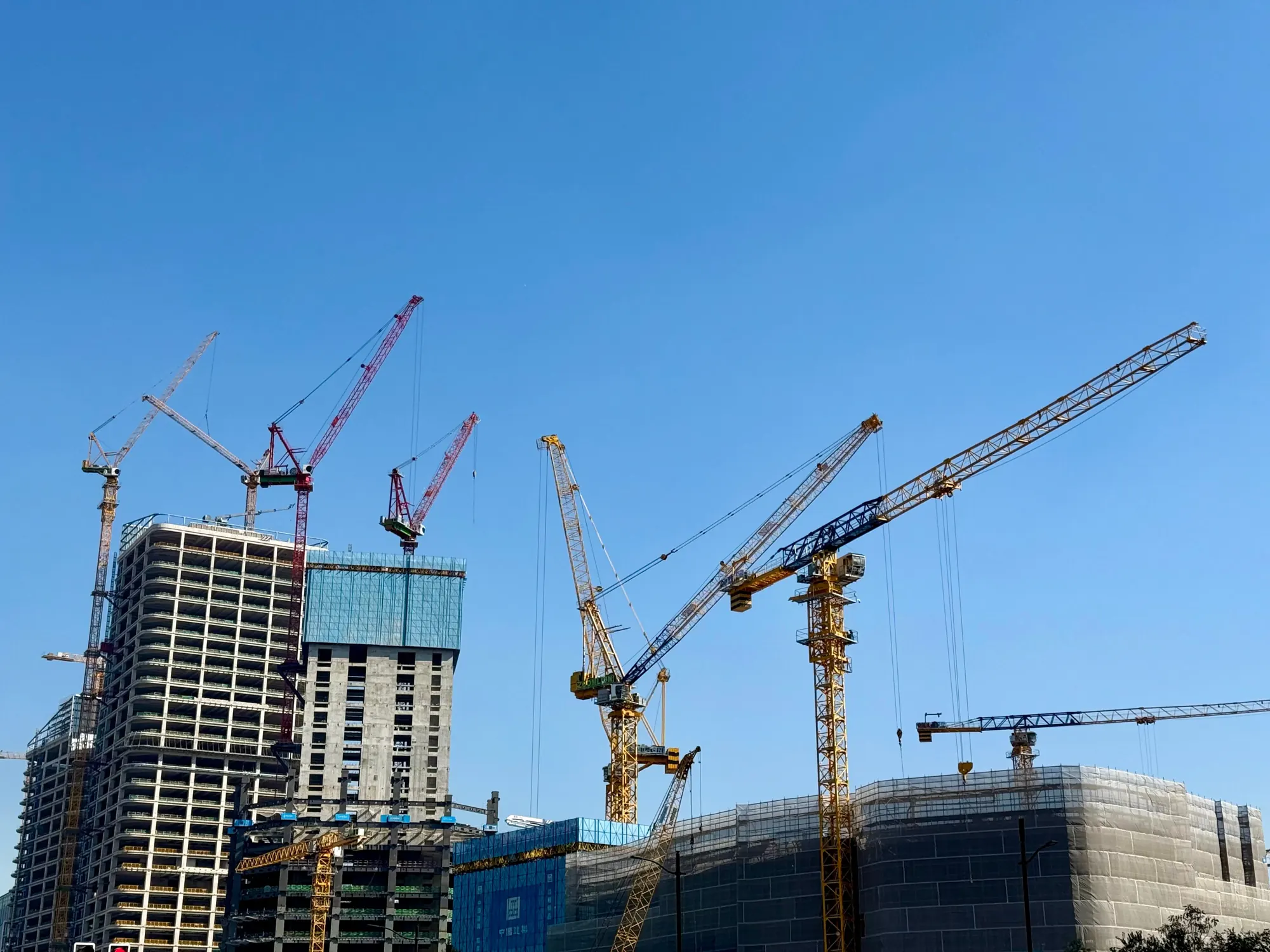 Tower cranes over high-rise towers under construction